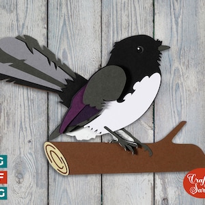 May include: A black and white bird with a purple chest perched on a brown branch. The bird has a long, gray tail. The background is a woodgrain pattern. The text "Craft with Sarah" is in a red circle.