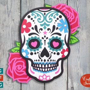 May include: A colorful sugar skull with floral designs and pink hearts for eyes. The skull is surrounded by two pink roses with green leaves. The text "Craft with Sarah" is in the lower right corner.