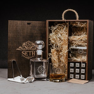 Elevate his drinking experience with our exquisite engraved decanter set, complete with whiskey stones. Crafted to perfection, this personalized gift adds a touch of sophistication to any occasion.