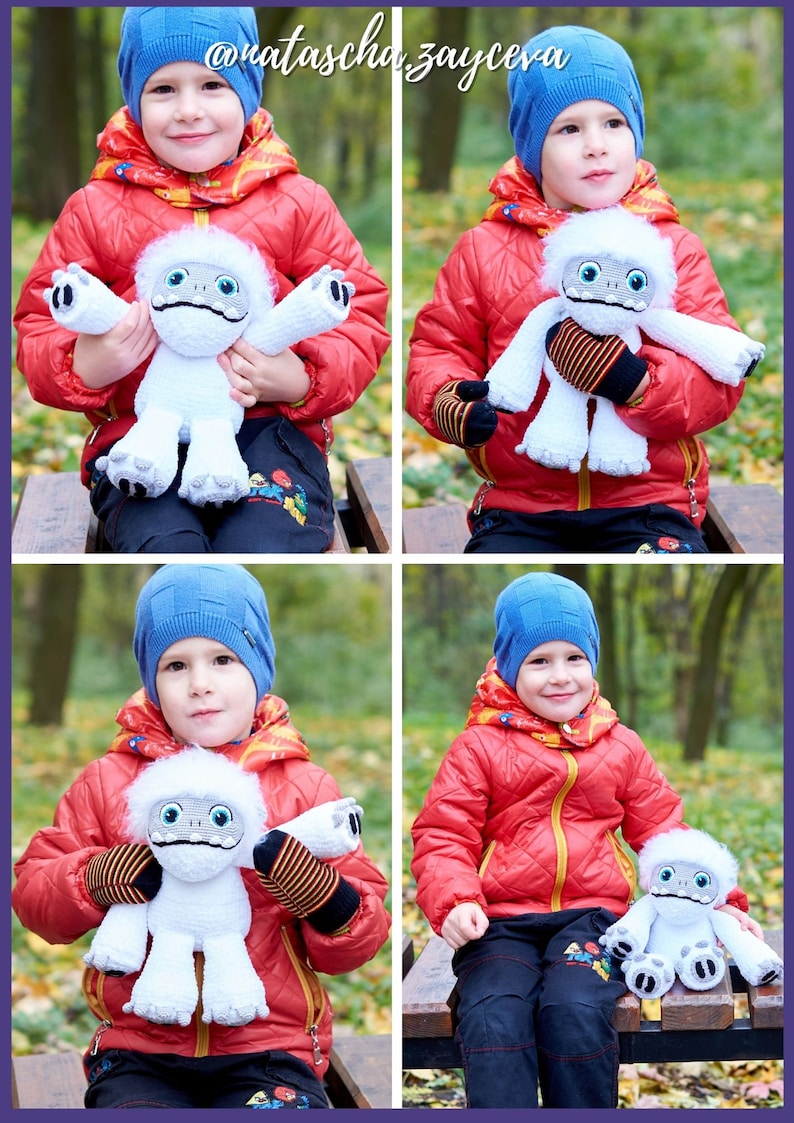 May include: A young person wearing a red jacket and blue hat is holding a white plush toy with a black nose and eyes. The toy is a Yeti from the movie "Abominable".