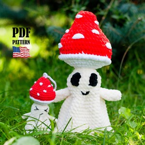 May include: A pair of crocheted mushroom figures, one large and one small, with red and white caps and white bodies. The larger mushroom figure has black eyes and a smiling mouth. The image includes the text "PDF PATTERN" and an American flag.