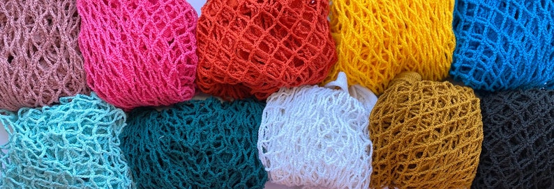 May include: Assortment of ten colorful string mesh bags in various colors including teal, pink, white, brown, orange, yellow, blue, and black.