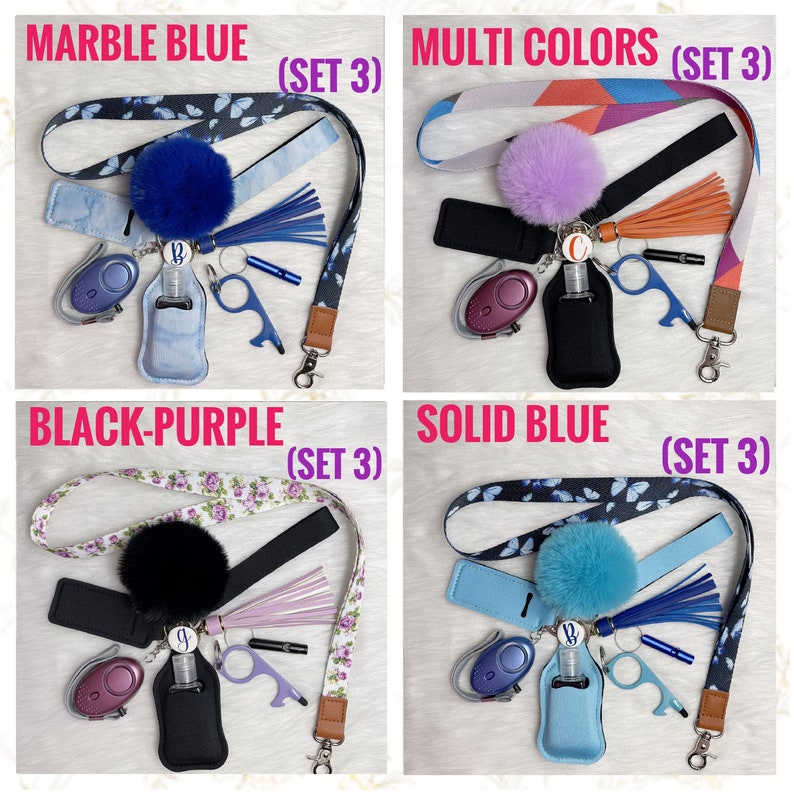 May include: Four sets of keychains with different colored lanyards and charms. Each set includes a blue, purple, black, and solid blue lanyard with a matching charm. The charms include a small bottle of hand sanitizer, a keychain, a small bottle opener, and a personal alarm.