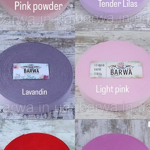 May include: Six spools of elastic fabric in various colors, including pink powder, tender lilas, lavandin, light pink, poppy, and peony. Each spool has a label with the word "BARWA" printed on it.