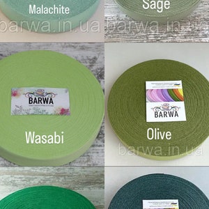 May include: Assortment of green and blue cotton ribbon rolls, each with a label that says "BARWA" and a different color name: Malachite, Sage, Wasabi, Olive, Green Grass, and Eucaliptus.