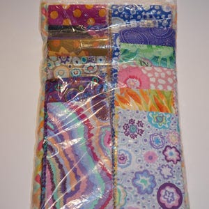 May include: A set of three ceramic mugs with a speckled, matte finish. The mugs are in shades of cream, light gray, and dark gray. Each mug has a simple, minimalist design, perfect for coffee or tea.