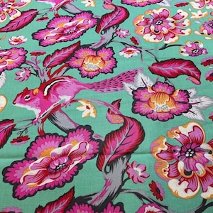 May include: A fabric with a vibrant floral and animal print. The design features pink flowers with orange centers, pink squirrels, and red leaves against a teal background. The pattern is detailed and colorful.