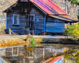 Farmhouse reflection in water