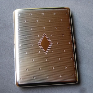 Custodia tascabile Super Slim Art Deco. Un lato. Design a molla per un'apertura a freddo. Prodotto in Germania e assemblato a mano da artigiani. Qualità