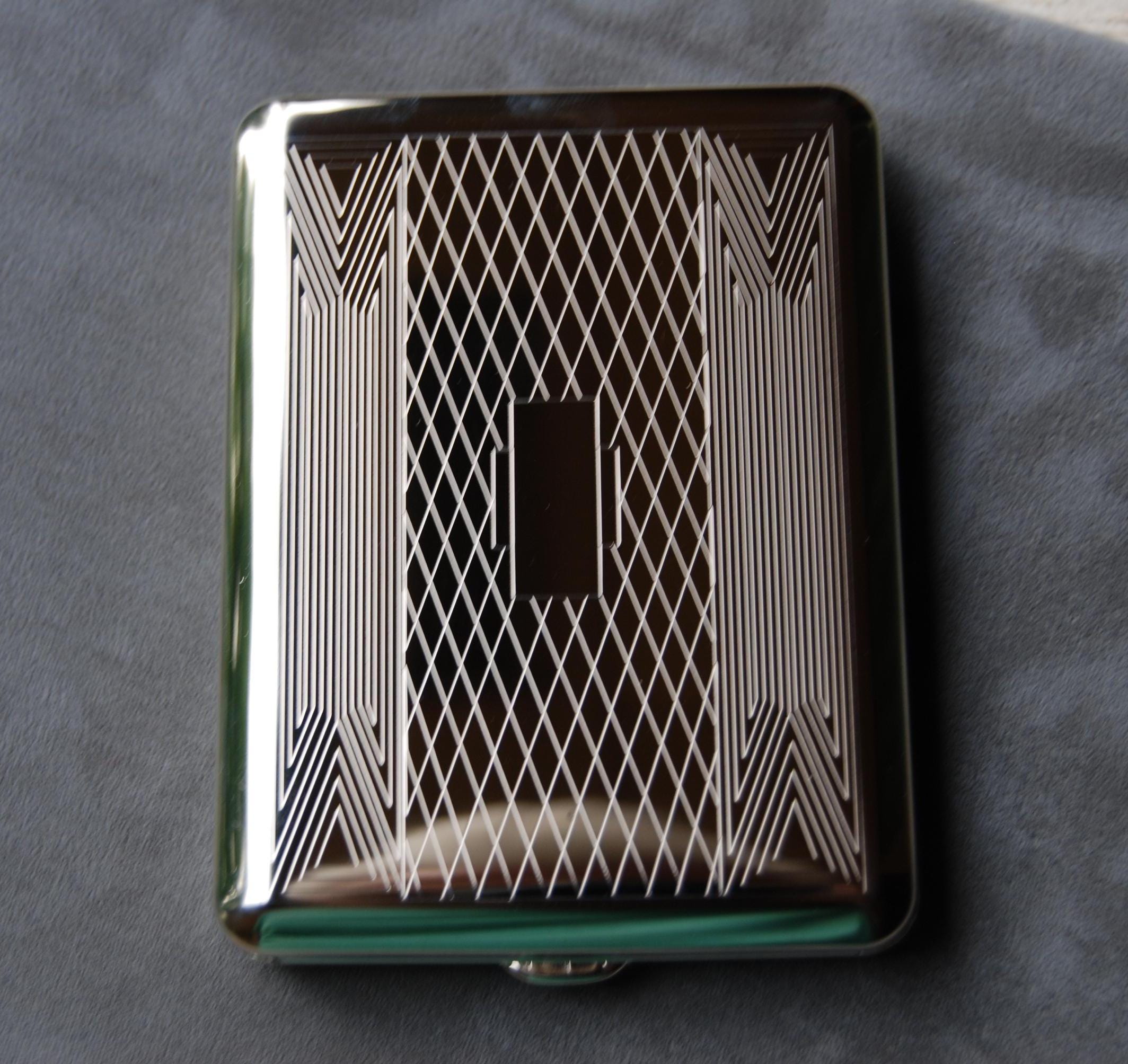 High Art Deco 100mm cigarette case. Holds cards, Id's, 16 cigarettes, Money, Thumb drives or what you will securely.  Made in Germany.