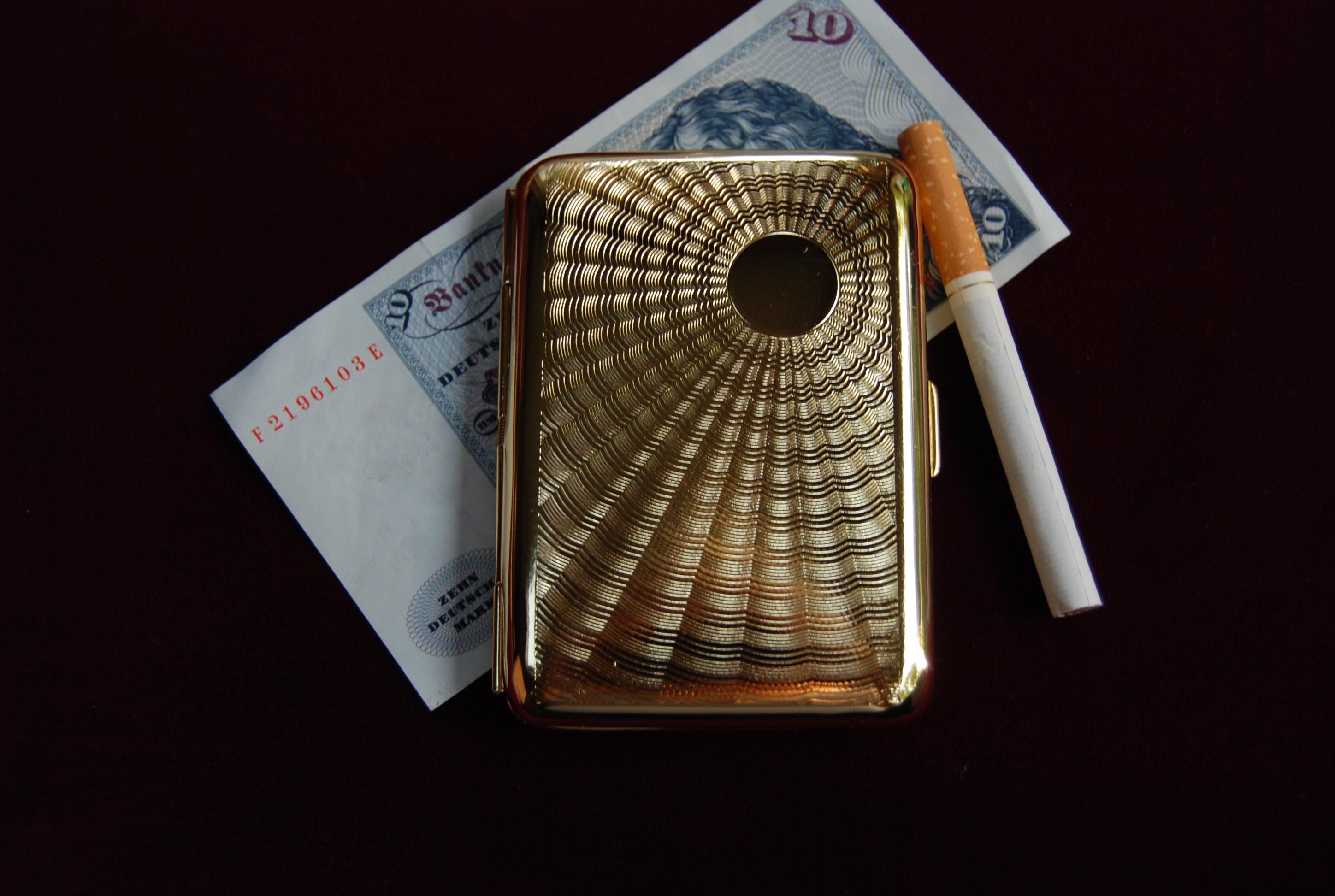 packing a cigarette Plain Cigarette Packages May Deter Smokers, Studies Show