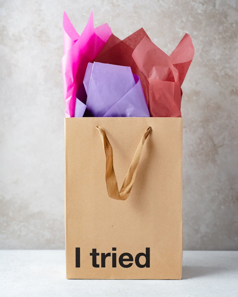 A funny gift bag made from eco-friendly brown kraft paper with "I tried" written on the front