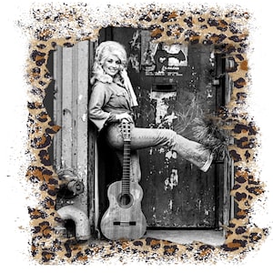 May include: A black and white graphic print featuring a portrait of a blonde person with voluminous hair, wearing a denim shirt and jeans, leaning against a weathered door while holding an acoustic guitar, framed by a brown leopard print border.