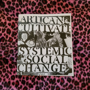 May include: A black and white zine with the title "ARTICAND CULTIVATE SYSTEMIC SOCIAL CHANGE VOL. 1" printed on the front cover.