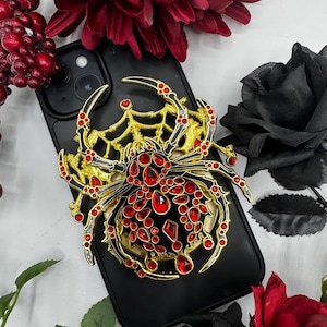 Enamel pin black widow phone holder accessory gold plated with rhinestones