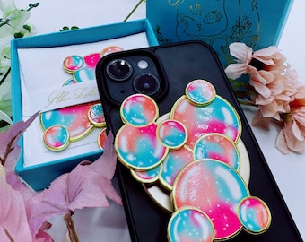 Soporte o pin para teléfono con diseño de burbujas arcoíris esmaltadas