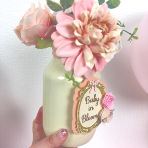 close up of baby in bloom centerpiece showing layered cardstock design and floral accents