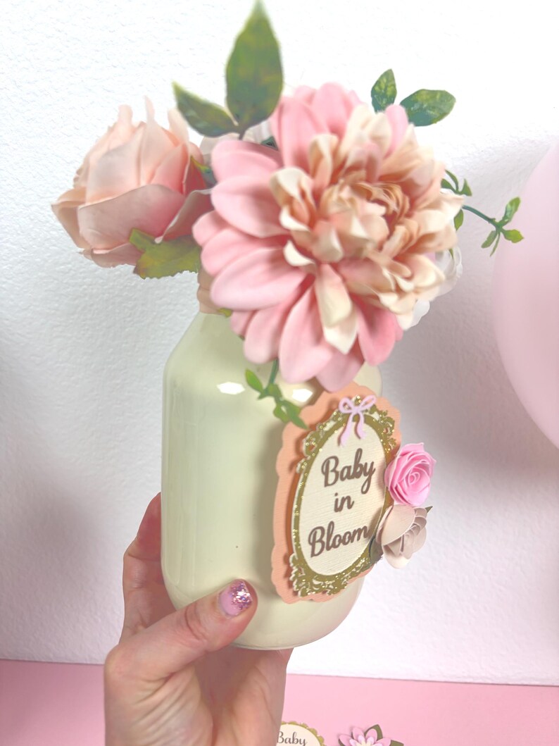close up of baby in bloom centerpiece showing layered cardstock design and floral accents