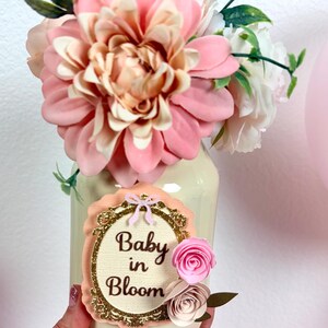 close up of baby in bloom centerpiece showing layered cardstock design and floral accents
