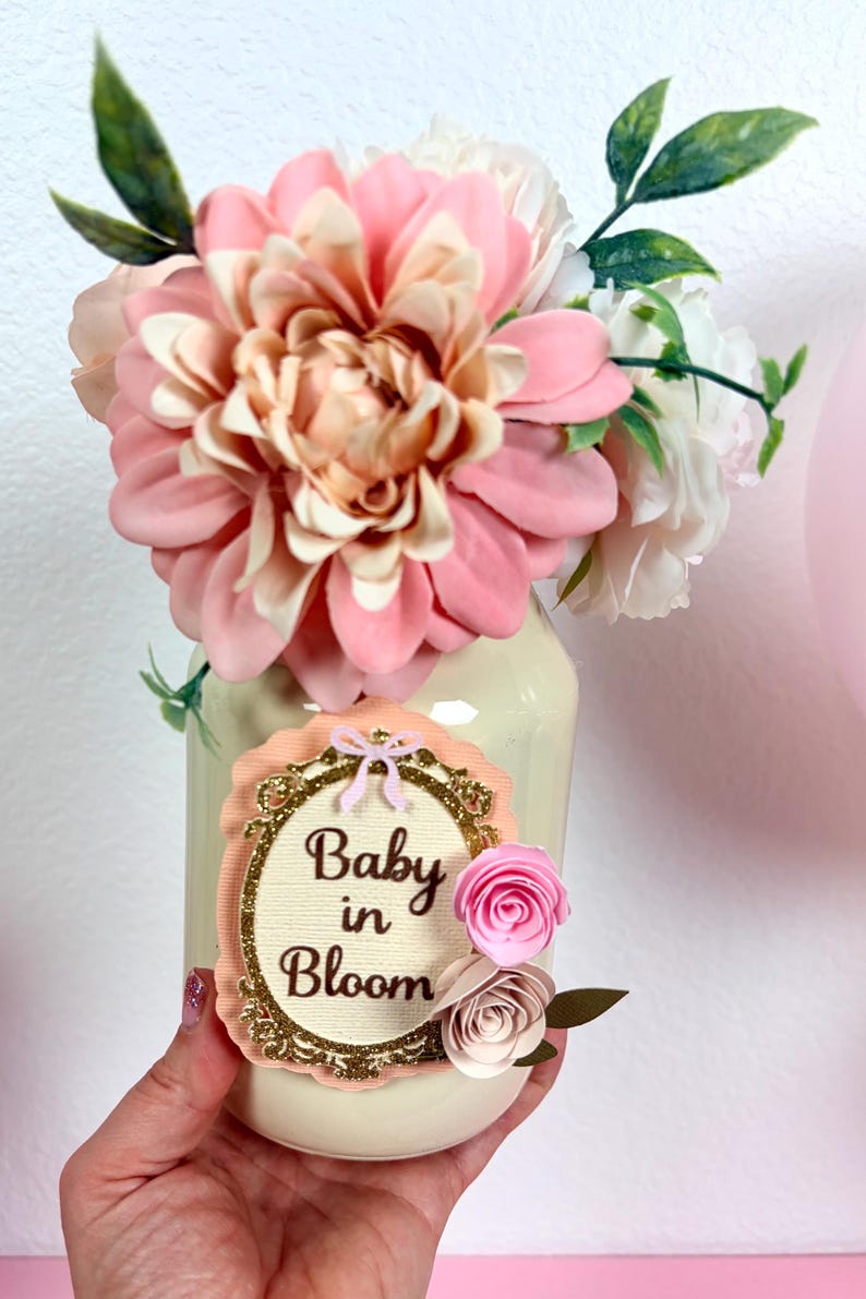 close up of baby in bloom centerpiece showing layered cardstock design and floral accents