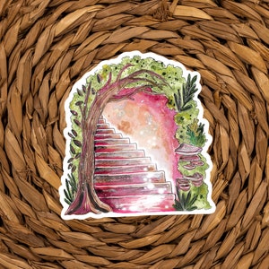 May include: A whimsical sticker featuring a watercolor illustration of a staircase leading into a magical portal. The stairs are a reddish-brown, framed by a tree and lush greenery. Mushrooms and a starry sky add to the fantasy theme.