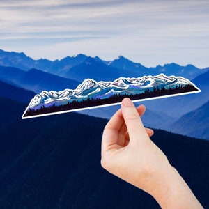 May include: A sticker of a mountain range with snow-capped peaks and a dark blue, green, and purple color scheme.