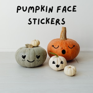 May include: Image of pumpkins with drawn-on faces. The pumpkins are in various sizes and colors, including orange, white, and gray. The text "PUMPKIN FACE STICKERS" is written in black above the pumpkins.