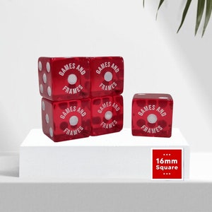 May include: Five translucent red six-sided dice, each measuring 16mm square. The dice feature white pips and the text "GAMES AND FRAMES" printed in white around the centre pip on one face. The dice are arranged in a stack of four with one separate.