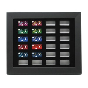 May include: Black shadow box display with 16 slots for dice. The slots are filled with colorful dice with the word "PALMS" and "GOOD TIMES" printed on them.