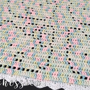 May include: A crocheted blanket featuring a variegated yarn pattern in pastel shades of pink, blue, yellow, and white. The fabric has an open, airy stitch design with a solid white scalloped border along the edge. The text @crochessica is visible.