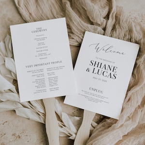 May include: A white wedding ceremony program with black text. The program includes the order of events, the names of the wedding party, and the date of the wedding. The program is on a wooden fan.