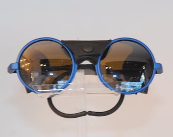 Ice spotive sunglasses, attractive blue-circular form face with soft branches insertion, blacky lenses color Sportive look made in France