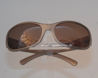Prada  sunglasses, shining grey curved face in cellulose acetate, with brown color lenses, New-york style made in Italy