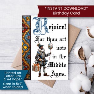 May include: A birthday card with a medieval theme. The card features an illustration of a man in Renaissance attire holding a balloon and a gift. Text on the card reads "Rejoice! For thou art now in the Middle Ages." Card size is 5x7 inches when folded.