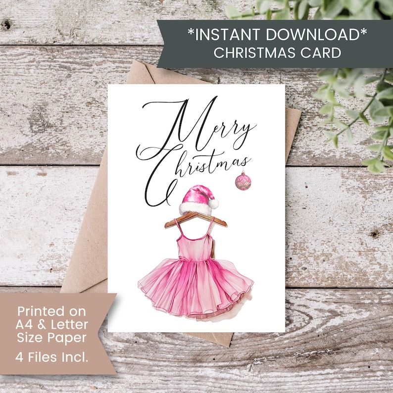 May include: Printable Christmas card featuring a pink tutu with a Santa hat on a hanger. The card says "Merry Christmas".