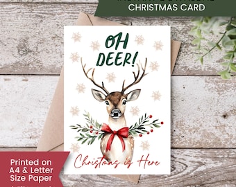 May include: A Christmas card with a watercolor illustration of a deer with antlers, a red bow, and greenery. The card reads "Oh Deer!" and "Christmas is Here." The top banner says "*INSTANT DOWNLOAD* CHRISTMAS CARD."
