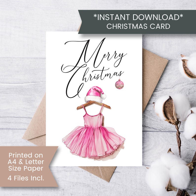 May include: Printable Christmas card featuring a pink ballerina dress with a Santa hat on a hanger. The text "Merry Christmas" is written in cursive above the dress.