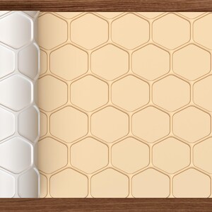 May include: A roll of material featuring a repeating hexagonal pattern. The left section shows a white, raised, three-dimensional honeycomb texture, while the right section displays a flat, light beige surface with the same hexagonal grid design.