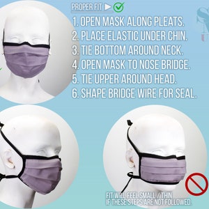 May include: Diagram showing the proper way to wear a purple face mask with black elastic straps and a black nose wire. The diagram shows a mannequin wearing the mask with a checkmark next to it. The diagram also shows a mannequin wearing the mask incorrectly with a red X next to it. The text on the diagram reads: "PROPER FIT 1. OPEN MASK ALONG PLEATS. 2. PLACE ELASTIC UNDER CHIN. 3. TIE BOTTOM AROUND NECK. 4. OPEN MASK TO NOSE BRIDGE. 5. TIE UPPER AROUND HEAD. 6. SHAPE BRIDGE WIRE FOR SEAL. FIT WILL FEEL SMALL/THIN IF THESE STEPS ARE NOT FOLLOWED."