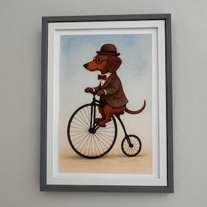 Stampa artistica di un bassotto vittoriano - Cane bassotto su bicicletta Penny Farthing - Illustrazione di un cane gentiluomo eccentrico - Regalo unico per gli amanti dei cani