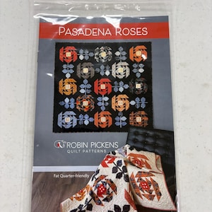 May include: A quilt pattern titled "Pasadena Roses" featuring a black background with colorful rose block designs. The pattern is "Fat Quarter-friendly" and includes a quilt and pillow example. The brand is "Robin Pickens Quilt Patterns."