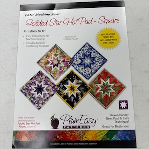May include: A sewing pattern titled "Folded Star Hot Pad - Square" with a finished size of 8 inches. The cover features examples of star-shaped hot pads in various colors and patterns. Includes easy instructions and a custom interfacing template.