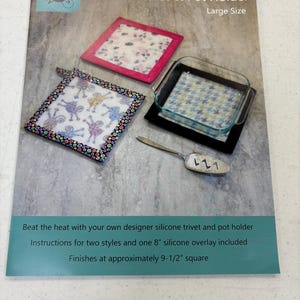 May include: A large-size trivet and pot holder kit with instructions. The kit includes two styles and an 8-inch silicone overlay. The finished product is approximately 9.5 inches square. The image shows a square trivet with a pink border and a square trivet with a black border.