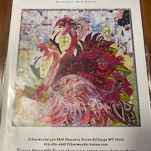 May include: A colorful quilt pattern featuring two pink flamingos with intricate floral and geometric designs. The quilt is titled "Opposites Attract" and is 30 inches wide by 30 inches high. The pattern is by Laura Heine and is available from Fiberworks inc. at 406-656-6663 or Fiberworks-heine.com. Copyright 2022 Laura Heine. Do not photocopy, resize, reproduce or share.