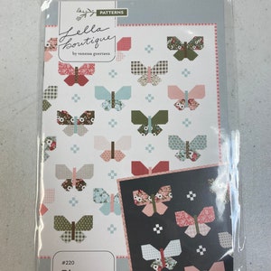 May include: A quilting pattern featuring a butterfly design. The pattern is called "Flutter" and is number 220. The pattern is by "Nella Boutique" by Vanessa Goertzen.