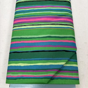 May include: A folded fabric with a vibrant striped pattern. The design features horizontal bands of various colors, including shades of green, blue, pink, and black. The fabric is neatly folded, revealing the pattern's repetition and color variations.