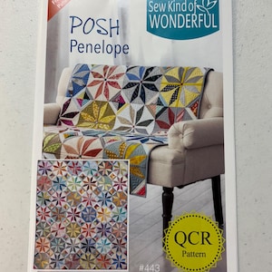 May include: Sew Kind of Wonderful quilt pattern called "Posh Penelope" with a colorful quilt design on a white armchair. The pattern number is #443 and is labeled as a "Stitch Friendly Pattern" and "QCR Pattern".