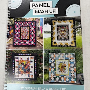 May include: A spiral-bound book titled "Panel Mash Up!" showcasing quilt designs. The cover presents four quilt examples with vibrant patterns. The book includes the text "20 Original Panel Designs" and "For the Love of Music & Quilts."