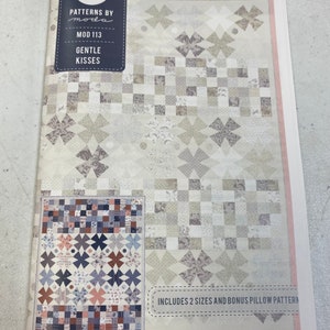 May include: A quilting pattern booklet with a pink and white cover. The cover features a stylized letter "M" and the text "Patterns by Moda, Mod 113, Gentle Kisses". The booklet includes two quilt sizes and a bonus pillow pattern.