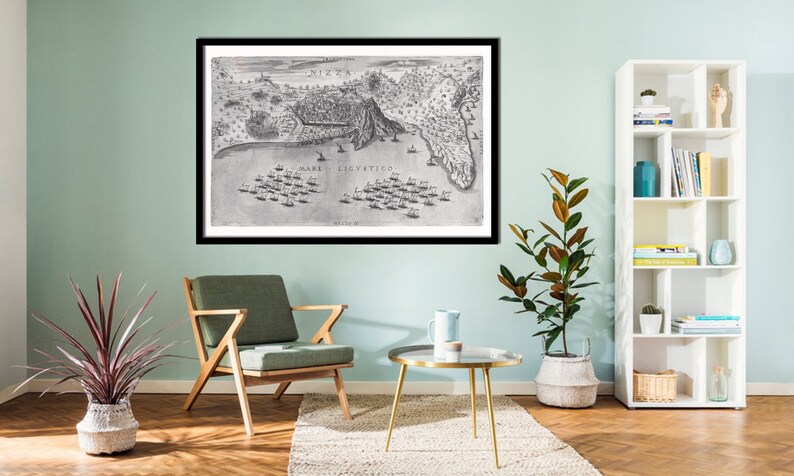 May include: A black and white framed print of a vintage map depicting a naval battle. The map is titled 'MARE LICVSTICO' and shows a coastal city with ships in the water.
